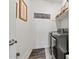 Cozy laundry room with machines, decor, and storage at 16139 S 178Th Dr, Goodyear, AZ 85338