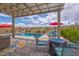 Outdoor space with a fire pit and a view of the pool and community at 16139 S 178Th Dr, Goodyear, AZ 85338