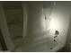 Bathroom featuring a full-size tub/shower combo with built-in shelves for toiletries at 16602 N 25Th St # 129, Phoenix, AZ 85032