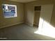 Cozy bedroom with carpet, a large window, and a sliding-door closet at 16602 N 25Th St # 129, Phoenix, AZ 85032