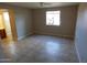 Bedroom with neutral walls, tile floors, ceiling fan and bathroom access at 16602 N 25Th St # 129, Phoenix, AZ 85032