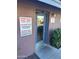 Exterior door of laundry room with posted hours and rules at 16602 N 25Th St # 129, Phoenix, AZ 85032