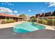 Inviting community pool with crystal-clear water, surrounding lounge area, and lush landscaping at 16602 N 25Th St # 129, Phoenix, AZ 85032