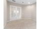 A versatile den space with bright tile floors and French doors at 16679 W Saguaro Park Ln, Surprise, AZ 85387