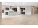 Open-concept kitchen with dark cabinets, an island, and stainless steel appliances at 16679 W Saguaro Park Ln, Surprise, AZ 85387