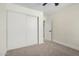 This bedroom features carpet floors and a closet with sliding doors for convenient storage at 17040 N 39Th Ave, Glendale, AZ 85308