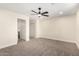 Neutral bedroom offering a ceiling fan, neutral walls, carpet flooring and ample natural light at 17040 N 39Th Ave, Glendale, AZ 85308