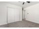 This bedroom features carpet floors and a closet with sliding doors for convenient storage at 17040 N 39Th Ave, Glendale, AZ 85308