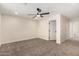 Bright, neutral bedroom showcasing a ceiling fan, carpet flooring, neutral walls and ample space at 17040 N 39Th Ave, Glendale, AZ 85308