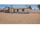Single-story home with rock yard and neutral color scheme under a clear sky at 17040 N 39Th Ave, Glendale, AZ 85308