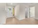 Bright foyer with light wood floors, white walls, and clear front door at 17040 N 39Th Ave, Glendale, AZ 85308