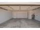 Clean two-car garage featuring ample space for parking and storage, with a freshly painted interior at 17040 N 39Th Ave, Glendale, AZ 85308