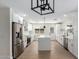 Spacious kitchen offering stainless steel appliances, large island with seating, and open floorplan at 17040 N 39Th Ave, Glendale, AZ 85308