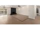 Open-concept living room with wood floors, black fireplace, and access to the backyard at 17040 N 39Th Ave, Glendale, AZ 85308
