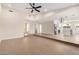 Open concept living room with vaulted ceilings and tile flooring at 17040 N 39Th Ave, Glendale, AZ 85308