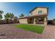 Backyard with low-maintenance landscaping and artificial turf at 18096 N Arbor Dr, Maricopa, AZ 85138