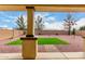 Relaxing backyard offers a covered patio, low-maintenance landscaping, and privacy at 18096 N Arbor Dr, Maricopa, AZ 85138