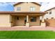 Backyard with a covered patio, gravel, a small lawn, and a block wall fence at 18096 N Arbor Dr, Maricopa, AZ 85138