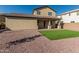 House exterior showcasing backyard and covered patio at 18096 N Arbor Dr, Maricopa, AZ 85138