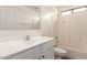 Clean bathroom features a white vanity, a shower-tub combo, and tile flooring at 18096 N Arbor Dr, Maricopa, AZ 85138