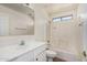 Bright bathroom with tub-shower, white vanity, and neutral finishes at 18096 N Arbor Dr, Maricopa, AZ 85138