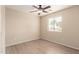 Inviting bedroom boasts a ceiling fan, window, and streamlined wood-look floors at 18096 N Arbor Dr, Maricopa, AZ 85138