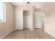 Bright bedroom features sleek flooring, neutral paint, and ample closet space at 18096 N Arbor Dr, Maricopa, AZ 85138