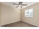 Bedroom with wood-look floors, ceiling fan and a bright window at 18096 N Arbor Dr, Maricopa, AZ 85138