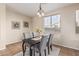 Cozy dining area featuring modern decor and a decorative light fixture at 18096 N Arbor Dr, Maricopa, AZ 85138