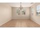 Elegant dining room with tile flooring and a decorative chandelier, offering a simple yet inviting space at 18096 N Arbor Dr, Maricopa, AZ 85138