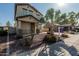 Charming home featuring desert landscaping, a quaint front porch, and a two-car garage at 18096 N Arbor Dr, Maricopa, AZ 85138