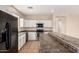 Updated kitchen with white cabinetry, stainless steel oven, and a breakfast bar at 18096 N Arbor Dr, Maricopa, AZ 85138