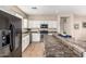 Kitchen featuring ample counter space, stainless steel appliances, and tile flooring at 18096 N Arbor Dr, Maricopa, AZ 85138