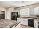 Kitchen with a black refrigerator and white cabinets at 18096 N Arbor Dr, Maricopa, AZ 85138