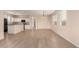 Inviting open-concept living room with large windows and adjacent kitchen area at 18096 N Arbor Dr, Maricopa, AZ 85138