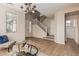 Open living room showcasing tile floors, a stairway, and lots of natural light at 18096 N Arbor Dr, Maricopa, AZ 85138