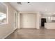 Spacious living room featuring light wood flooring and an open-concept design at 18096 N Arbor Dr, Maricopa, AZ 85138