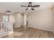 Spacious loft area featuring wood-look floors and natural light at 18096 N Arbor Dr, Maricopa, AZ 85138