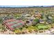 Panoramic aerial view of community with pools, tennis courts, basketball court, putting green and desert landscaping at 1915 N Bernard Cir, Mesa, AZ 85207