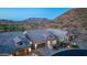 Picturesque aerial view showcasing beautiful homes with stunning mountain views in the distance at 1915 N Bernard Cir, Mesa, AZ 85207