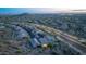 Scenic aerial view of a residential neighborhood featuring well-maintained homes and desert landscapes at 1915 N Bernard Cir, Mesa, AZ 85207