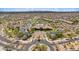 Aerial view of community center with pool, lush landscaping, and meticulously planned streets with desert homes at 1915 N Bernard Cir, Mesa, AZ 85207