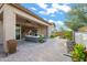 Paver patio with outdoor seating area, sliding glass doors, and a water feature at 1915 N Bernard Cir, Mesa, AZ 85207