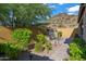 Landscaped backyard with plants, shrubs, paver patio and water feature at 1915 N Bernard Cir, Mesa, AZ 85207