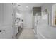 Bright bathroom with dual sinks, a walk-in shower, and a luxurious soaking tub at 1915 N Bernard Cir, Mesa, AZ 85207