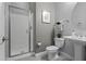 Well-lit bathroom features a glass-enclosed shower and pedestal sink at 1915 N Bernard Cir, Mesa, AZ 85207