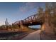 Picturesque view of a pedestrian bridge crossing a street, enhancing the community's charm and accessibility at 1915 N Bernard Cir, Mesa, AZ 85207