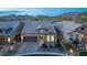 Attractive home featuring stone accents, manicured landscaping, and beautiful mountain views in the background at 1915 N Bernard Cir, Mesa, AZ 85207