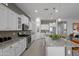 Well-equipped kitchen featuring granite countertops, stainless steel appliances, and a large island with bar seating at 1915 N Bernard Cir, Mesa, AZ 85207