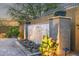 Backyard water feature with wall mounted planters and rocks at 1915 N Bernard Cir, Mesa, AZ 85207